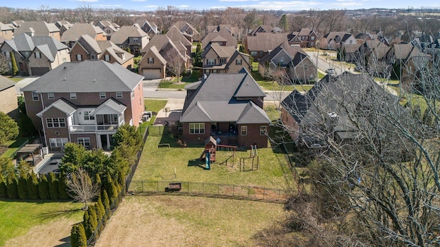 birds eye view of property with a residential view