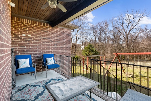 balcony with ceiling fan and a patio