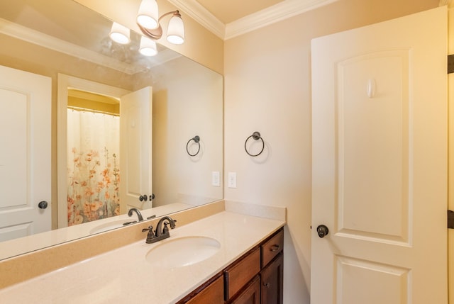 bathroom featuring crown molding and vanity