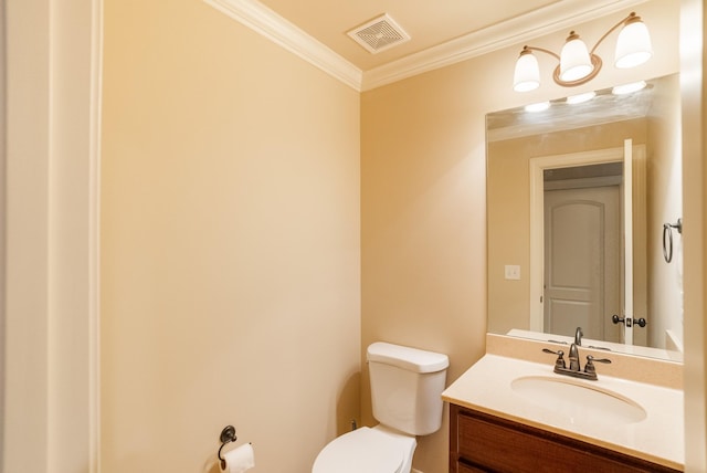 bathroom featuring ornamental molding, visible vents, vanity, and toilet