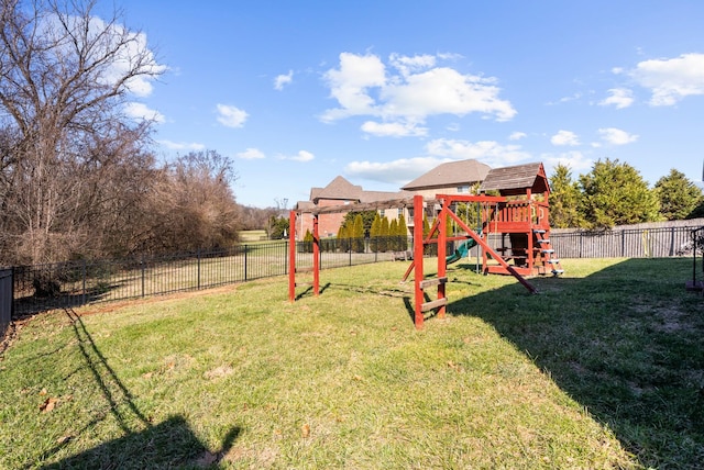 view of play area with a yard and fence