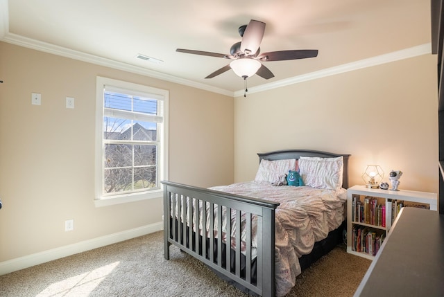 bedroom featuring ceiling fan, carpet flooring, visible vents, baseboards, and crown molding