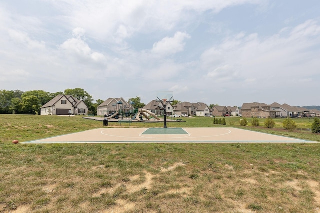 view of basketball court with community basketball court, playground community, and a yard