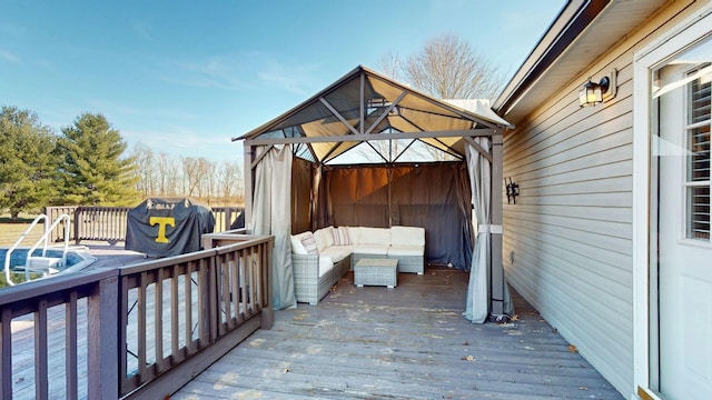 wooden deck featuring area for grilling