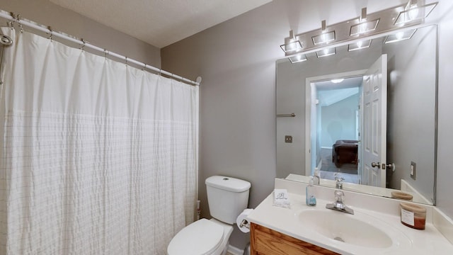 full bath featuring curtained shower, vanity, and toilet