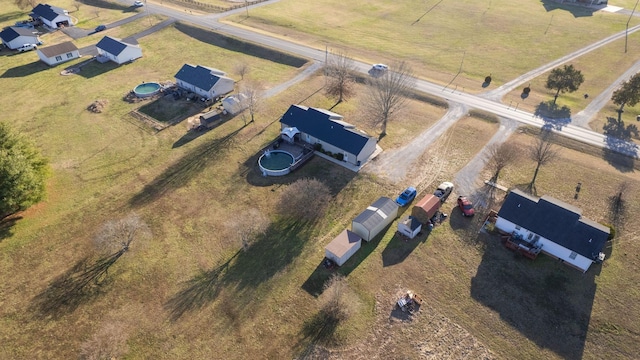 birds eye view of property featuring a rural view