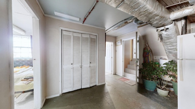 hall featuring concrete flooring