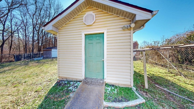 view of shed with fence