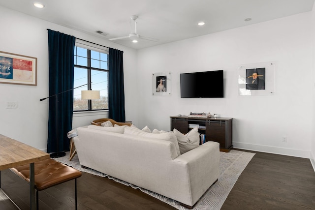 living area featuring ceiling fan, baseboards, dark wood-type flooring, and recessed lighting