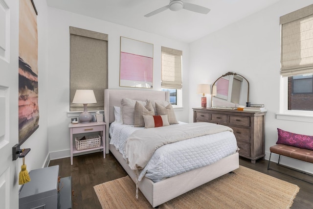 bedroom featuring a ceiling fan, dark wood finished floors, and baseboards