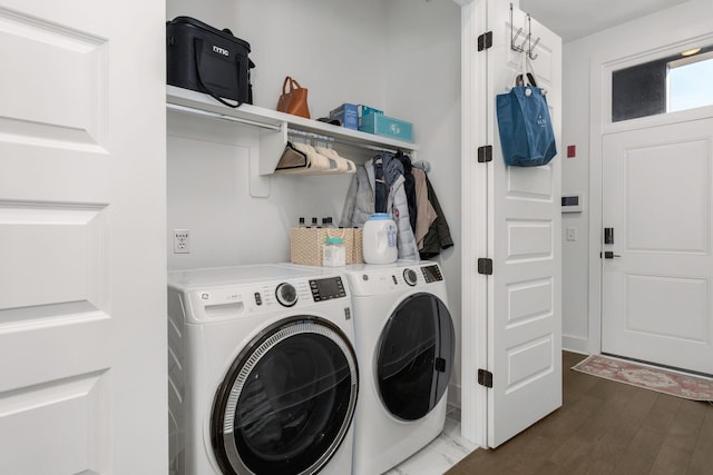 laundry area with laundry area, wood finished floors, and independent washer and dryer