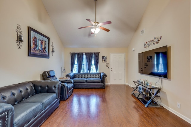 living room featuring dark wood-style floors, visible vents, ceiling fan, high vaulted ceiling, and baseboards