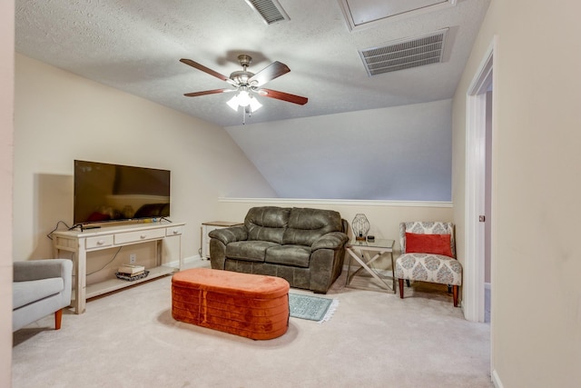 living room with lofted ceiling, visible vents, a textured ceiling, and carpet flooring