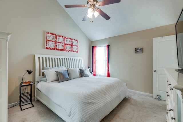 bedroom with a ceiling fan, lofted ceiling, light carpet, and baseboards