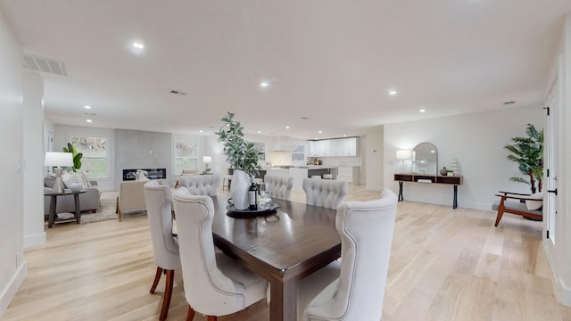 dining area featuring visible vents, baseboards, light wood-style flooring, and recessed lighting