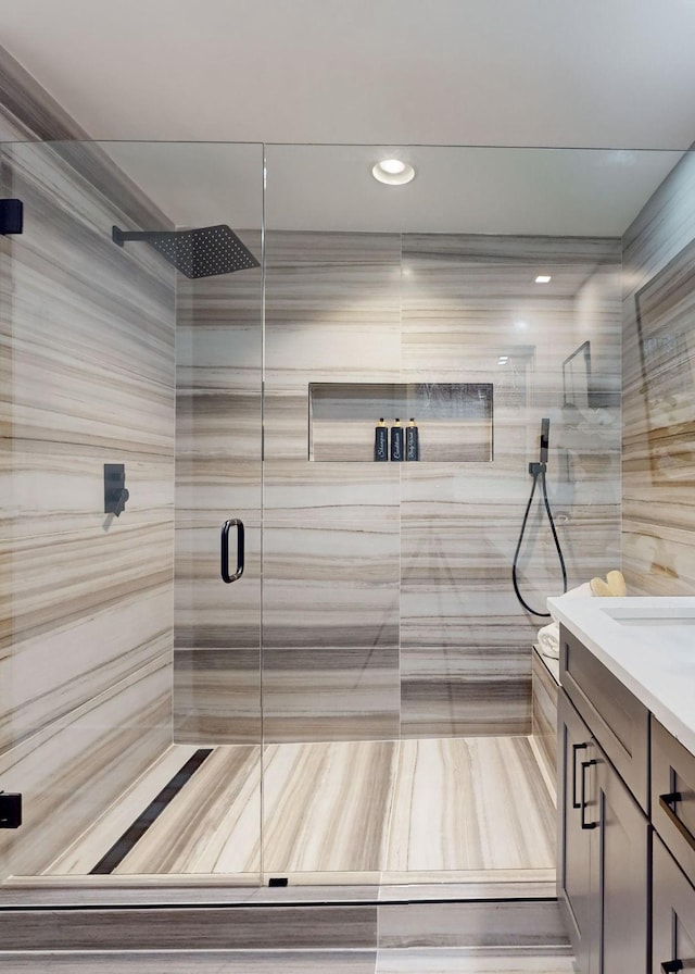 full bathroom with a stall shower, vanity, and a sauna