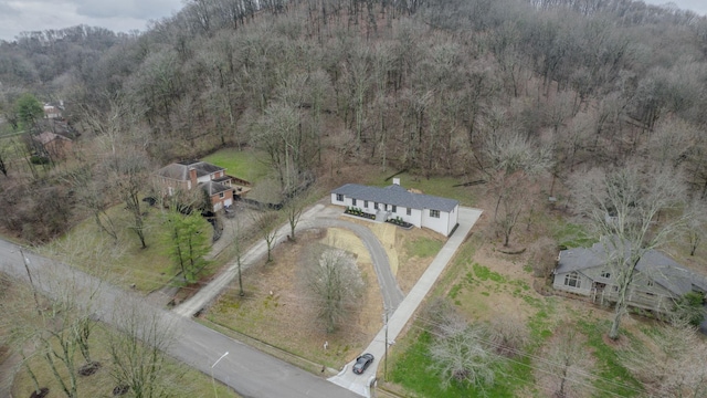 aerial view with a wooded view