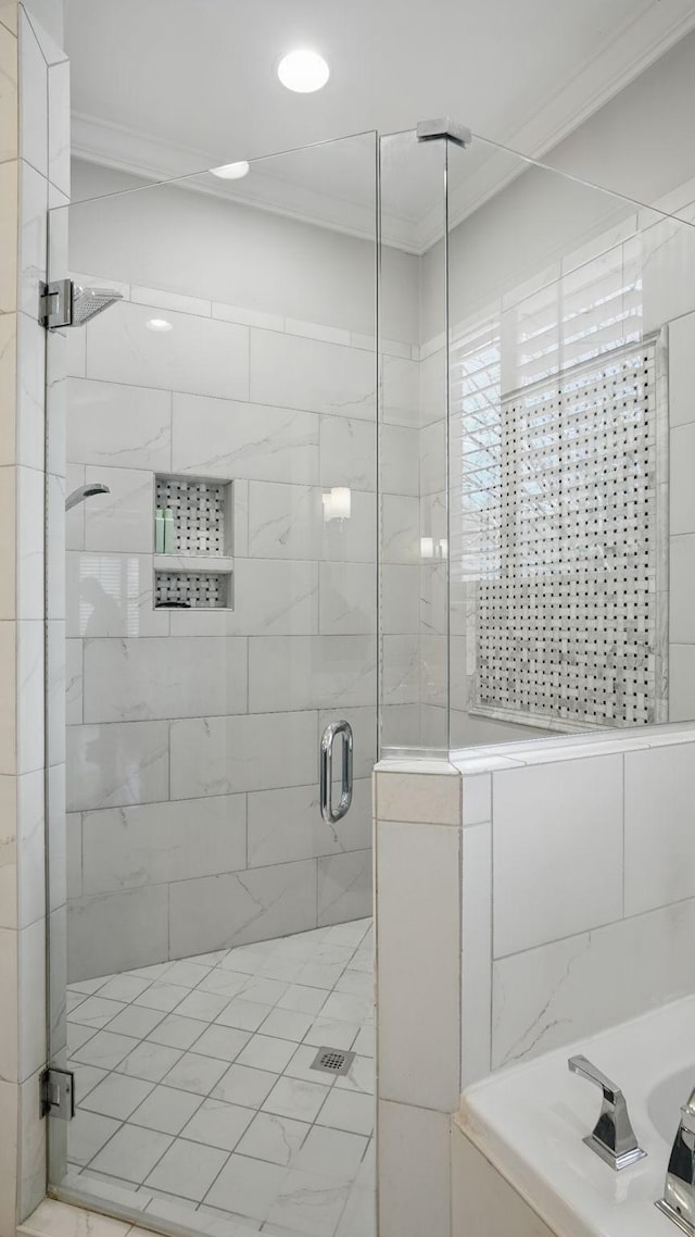 full bathroom featuring a shower stall and crown molding