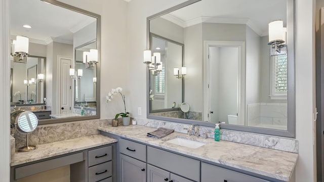 full bathroom with toilet, vanity, and crown molding