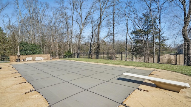 view of swimming pool featuring a patio area, fence, and a fenced in pool