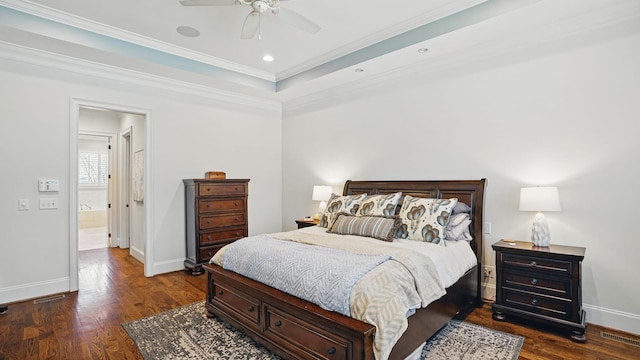 bedroom with crown molding, a raised ceiling, dark wood finished floors, and baseboards