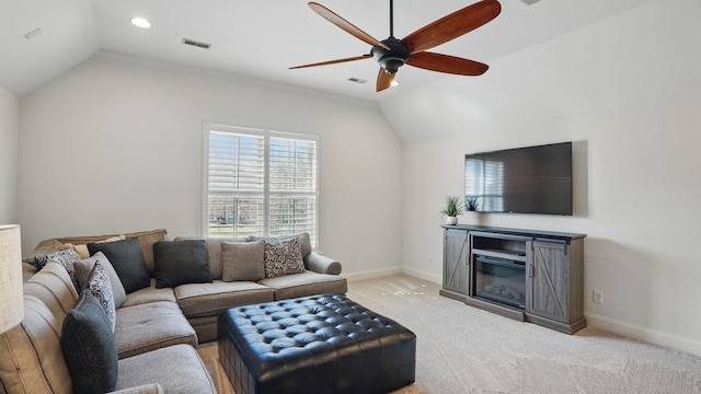 carpeted living area featuring a ceiling fan, visible vents, vaulted ceiling, and baseboards