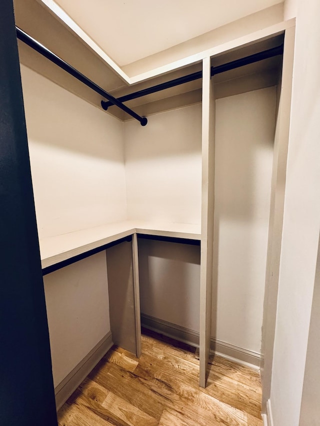 walk in closet featuring light wood-style floors