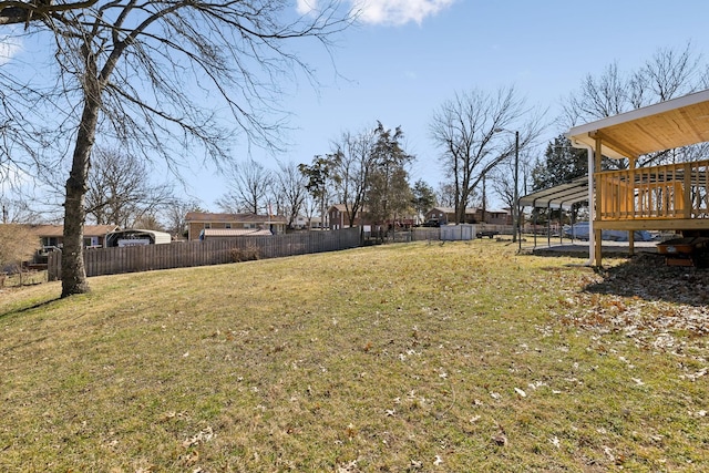 view of yard with fence and a wooden deck