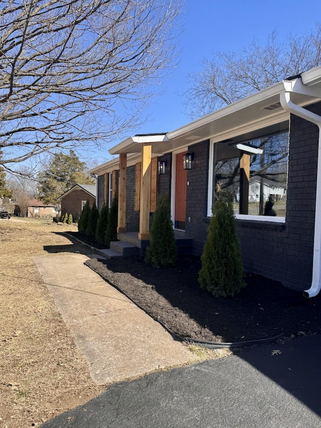 view of front of house with brick siding