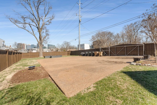 view of yard with an outbuilding, an outdoor structure, and fence