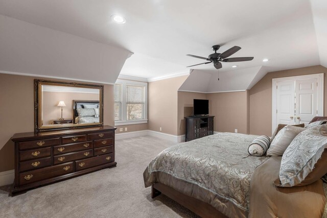 bedroom featuring crown molding, recessed lighting, light colored carpet, vaulted ceiling, and baseboards