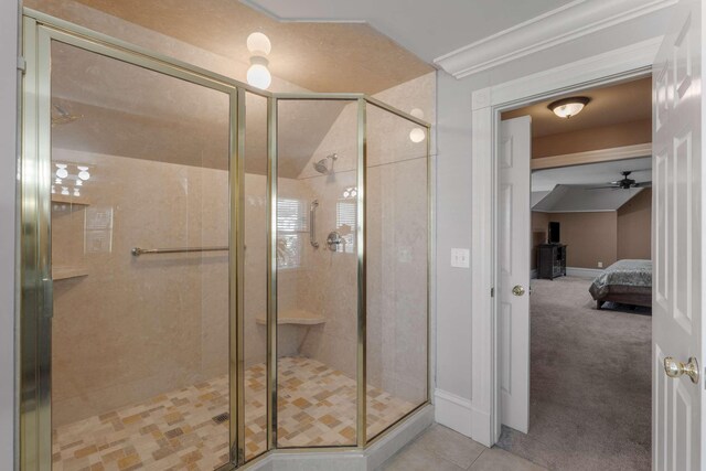 ensuite bathroom featuring ensuite bath, a shower stall, baseboards, and tile patterned flooring