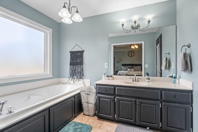 bathroom with an inviting chandelier, plenty of natural light, and connected bathroom