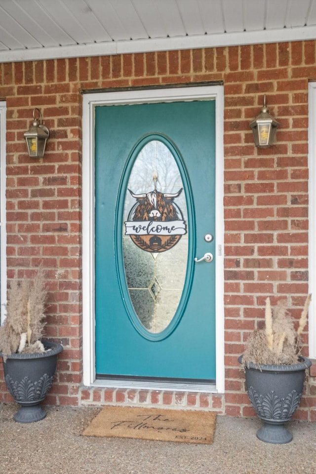 entrance to property with brick siding