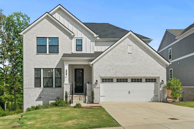 view of front of house featuring concrete driveway, a front lawn, board and batten siding, and brick siding