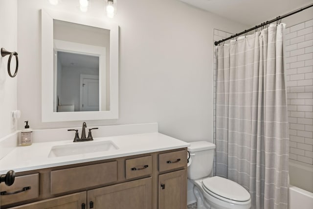 bathroom featuring vanity, toilet, and shower / bath combo with shower curtain