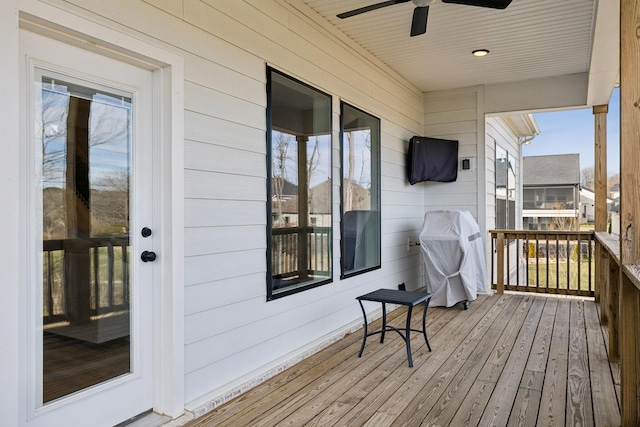 wooden deck with ceiling fan