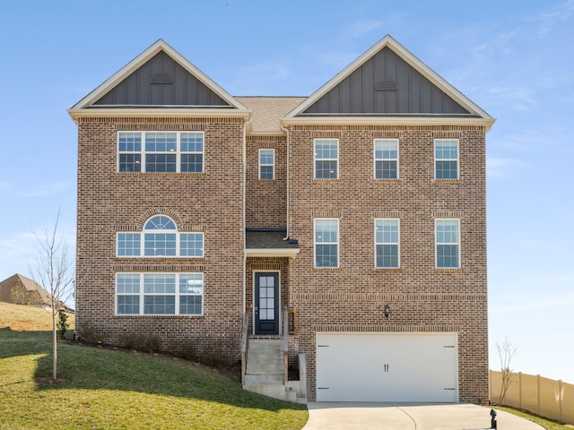 view of front facade featuring an attached garage, brick siding, concrete driveway, board and batten siding, and a front yard