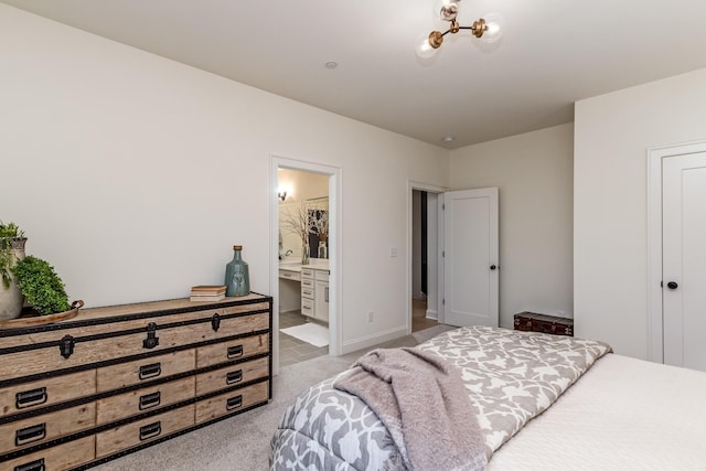 bedroom featuring light carpet, ensuite bathroom, and baseboards