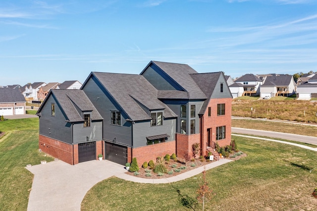 view of front facade featuring an attached garage, a residential view, a front lawn, and brick siding