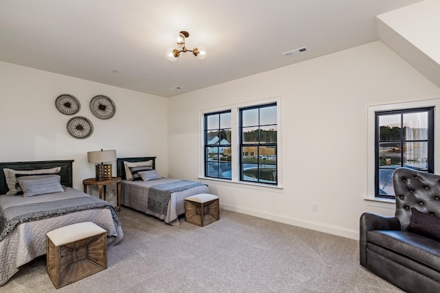 bedroom with vaulted ceiling, carpet flooring, visible vents, and baseboards