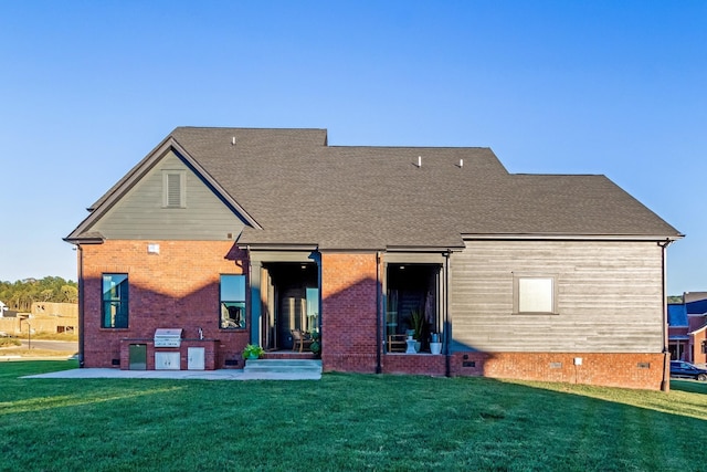 back of property with a yard and crawl space