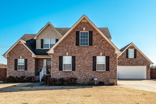 view of front of home featuring a garage, a shingled roof, concrete driveway, a front lawn, and brick siding