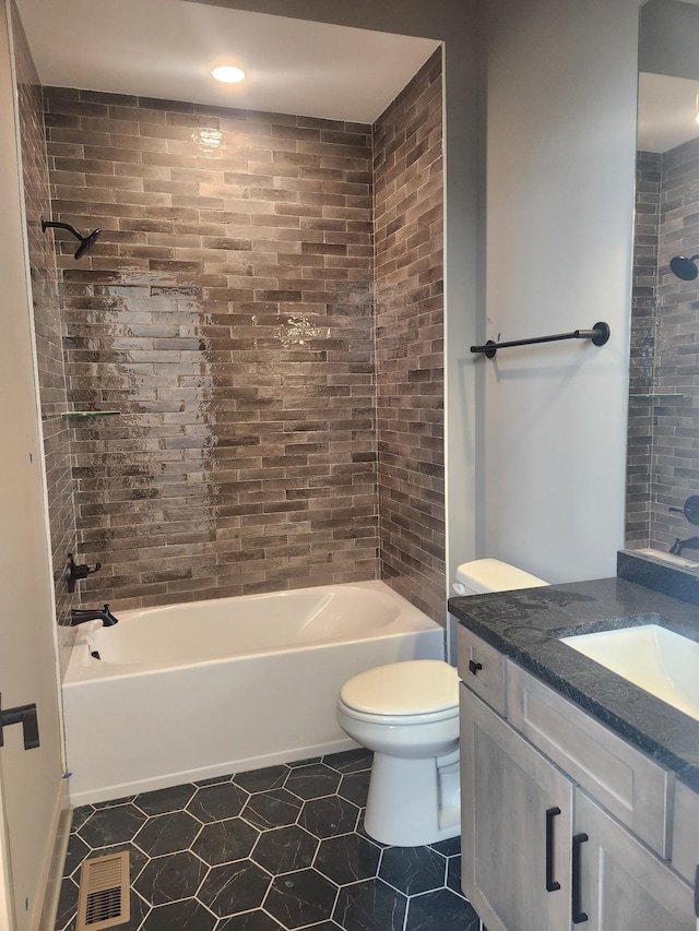 bathroom with visible vents, toilet,  shower combination, tile patterned flooring, and vanity