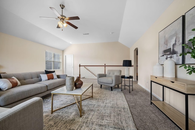 carpeted living room with arched walkways, visible vents, a ceiling fan, vaulted ceiling, and baseboards