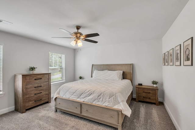 bedroom with a ceiling fan, carpet, visible vents, and baseboards