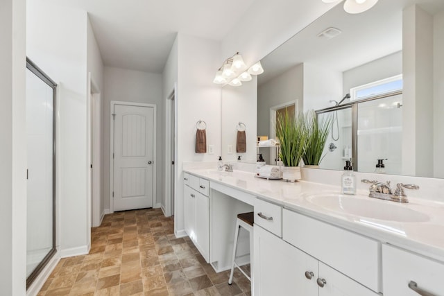 bathroom with a stall shower, visible vents, a sink, and double vanity