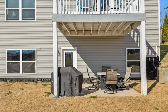 view of patio / terrace with a balcony and a grill