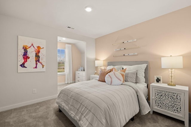 bedroom with carpet floors, visible vents, and baseboards