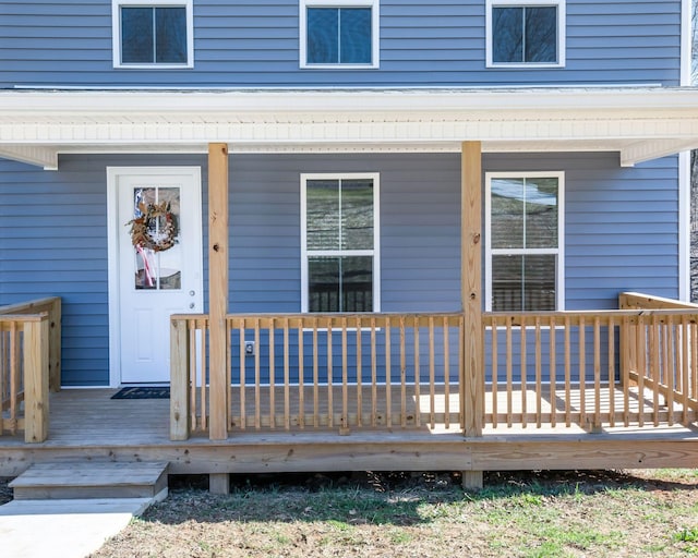 doorway to property with covered porch